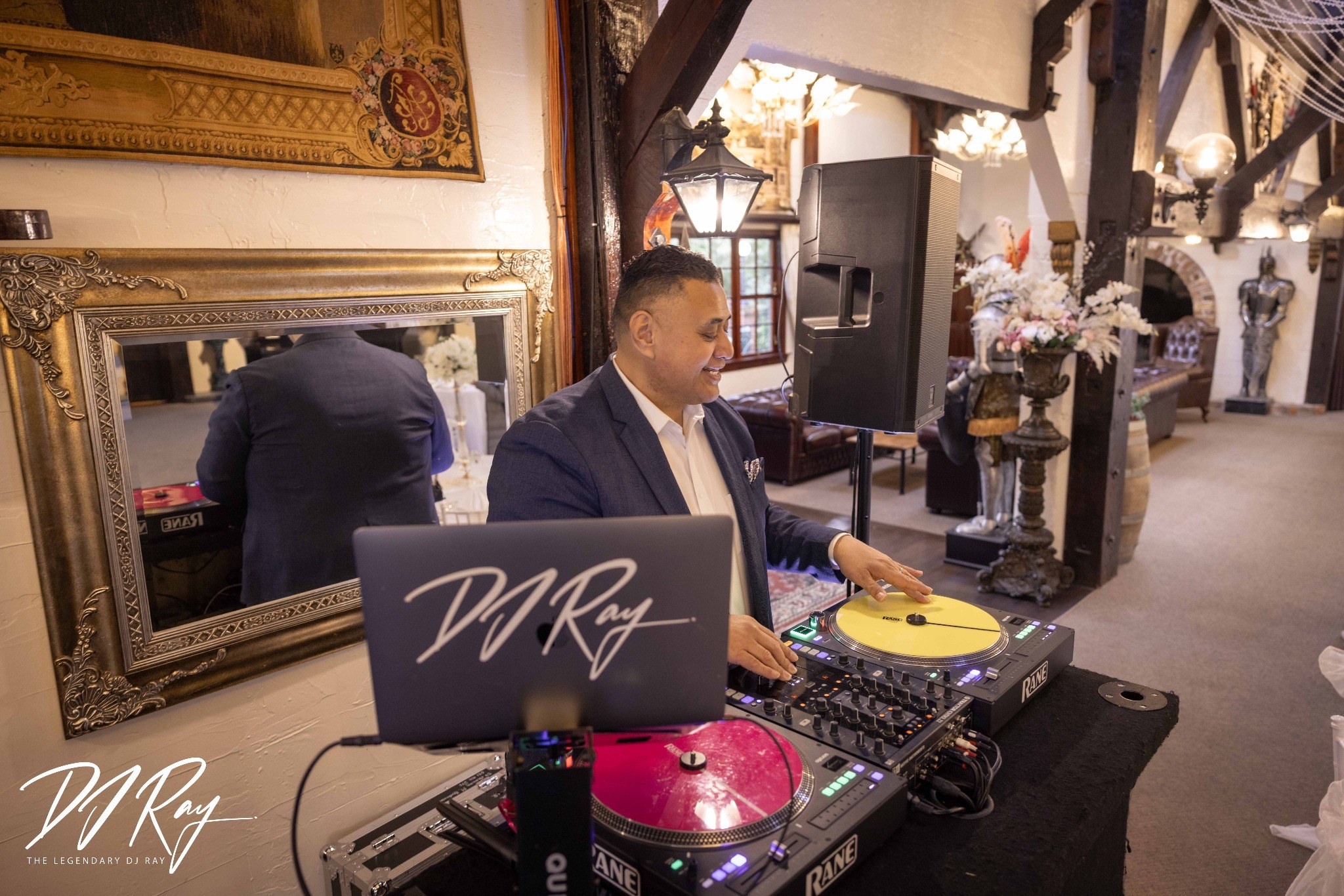 DJ Ray mixing music at a wedding