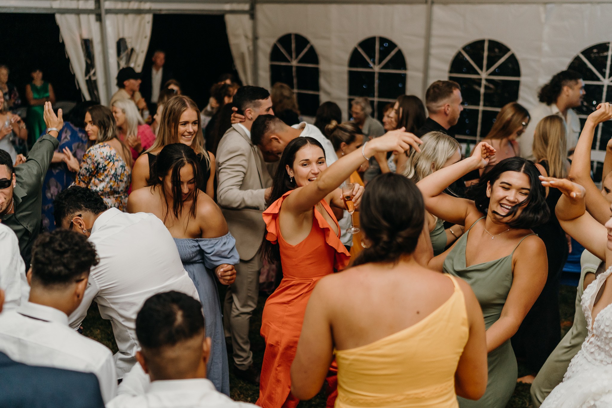 Wedding guests celebrating together on a packed dancefloor