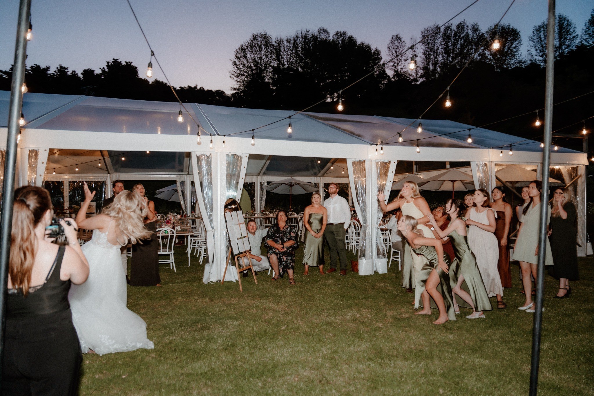 Families enjoying an outdoor wedding celebration